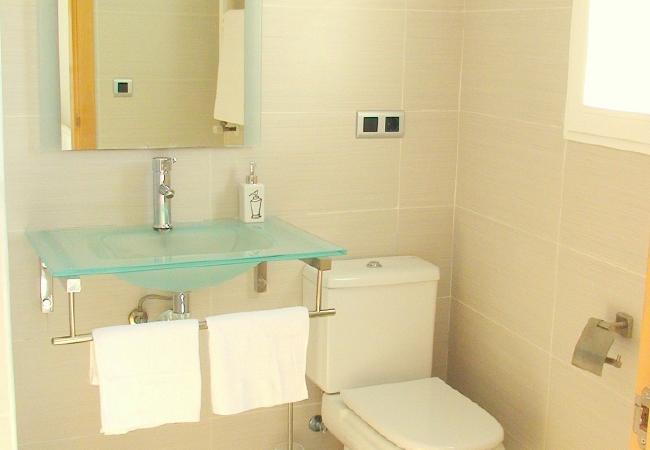 One bathroom has a bathtub and the other has a shower unit. Towels are included.