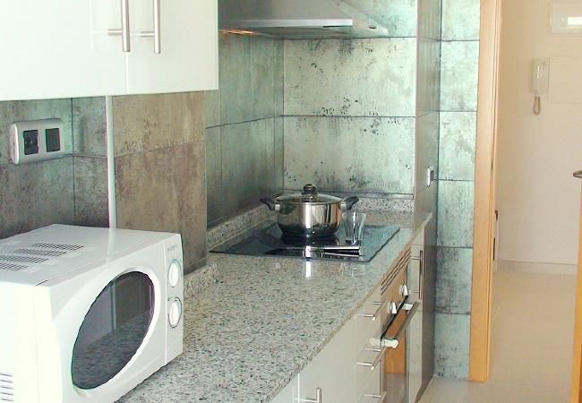 The kitchen is fully-equipped for cooking. There is a microwave, an oven, a hob, a fridge and kitchenware.