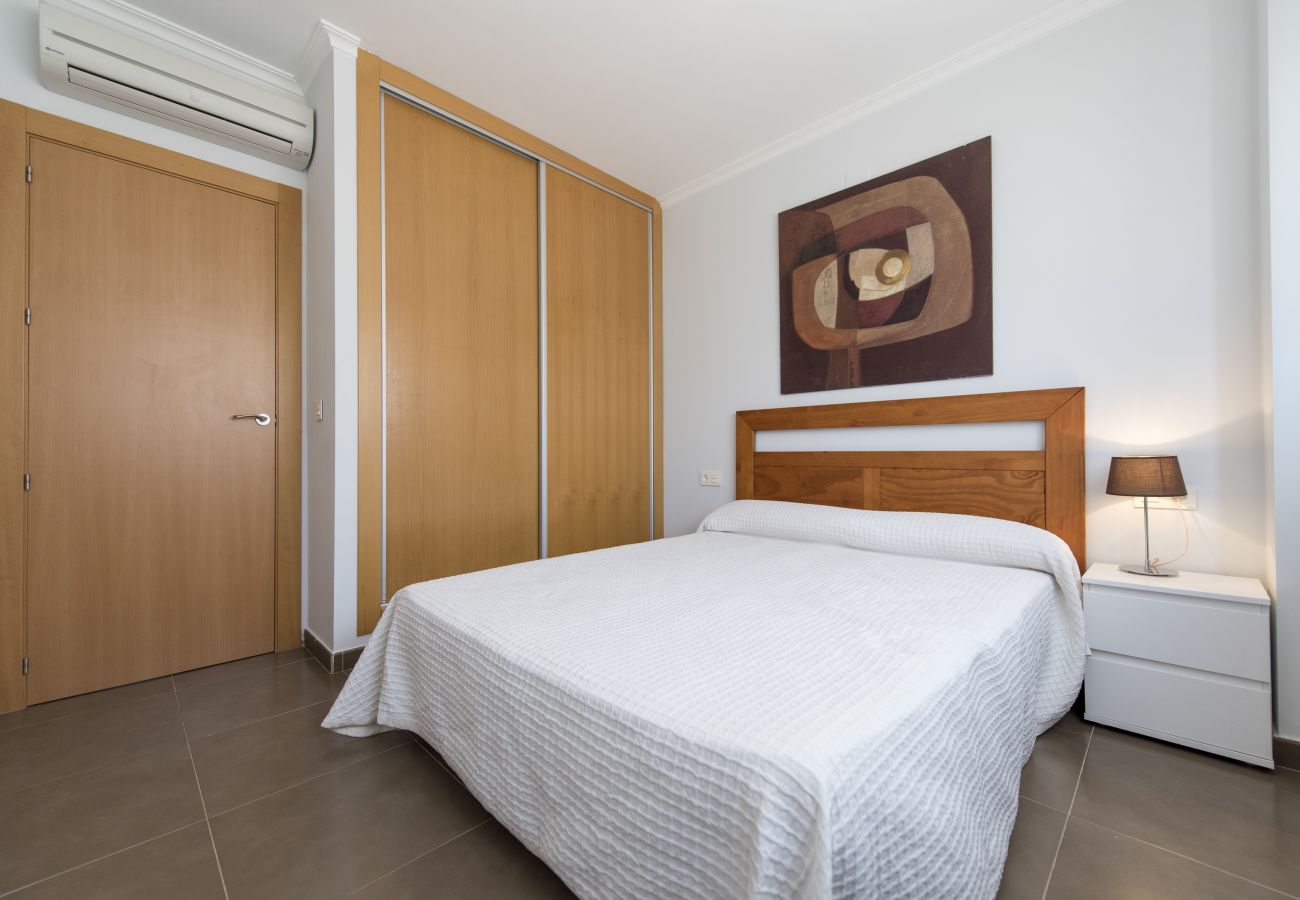 The master bedroom has a double bed, a bedside table, a lamp and bedsheets included. Its bright, airy and spacious.