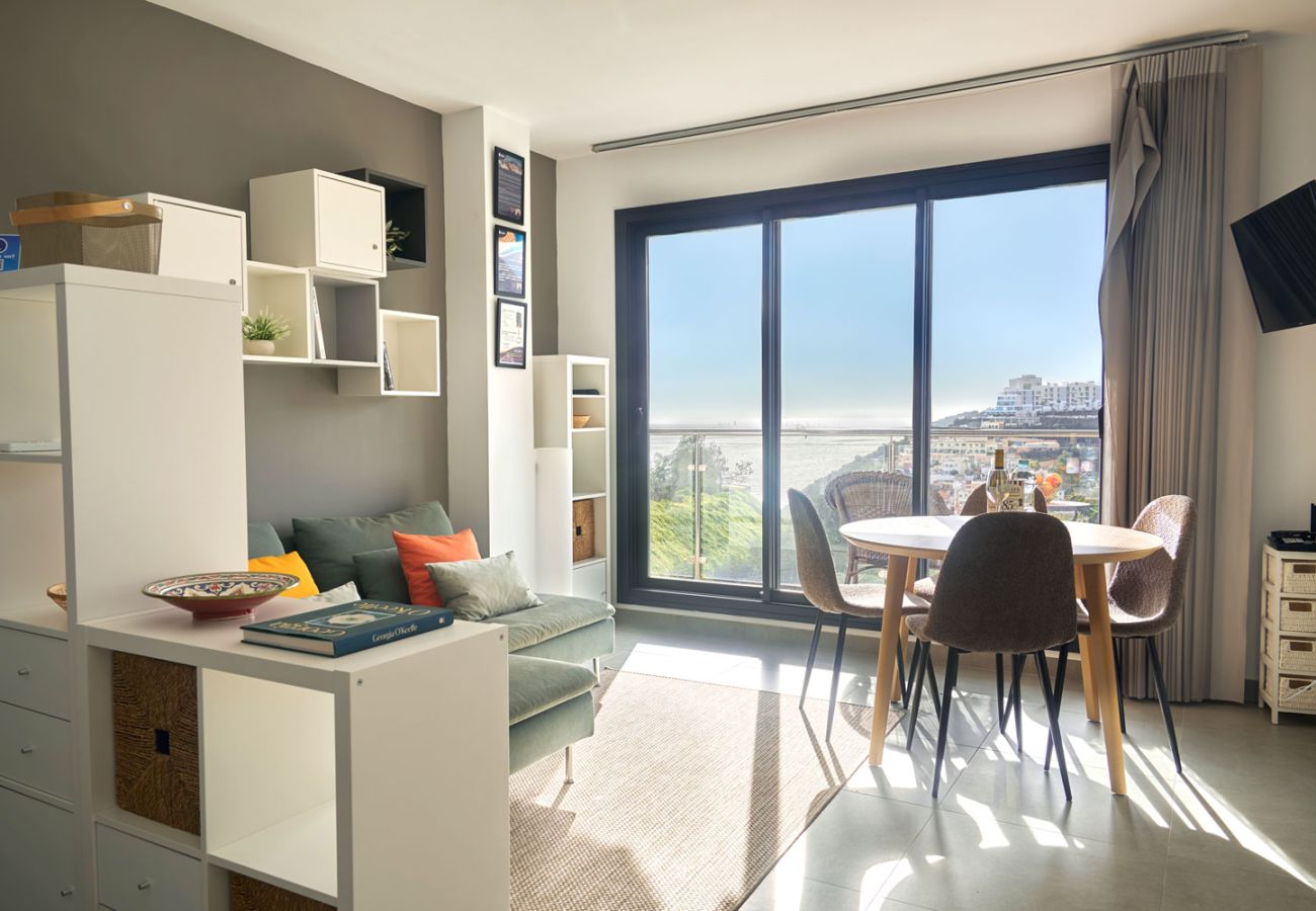 Modern living room with direct terrace access and sea views in Balcón del Mar Nerja.