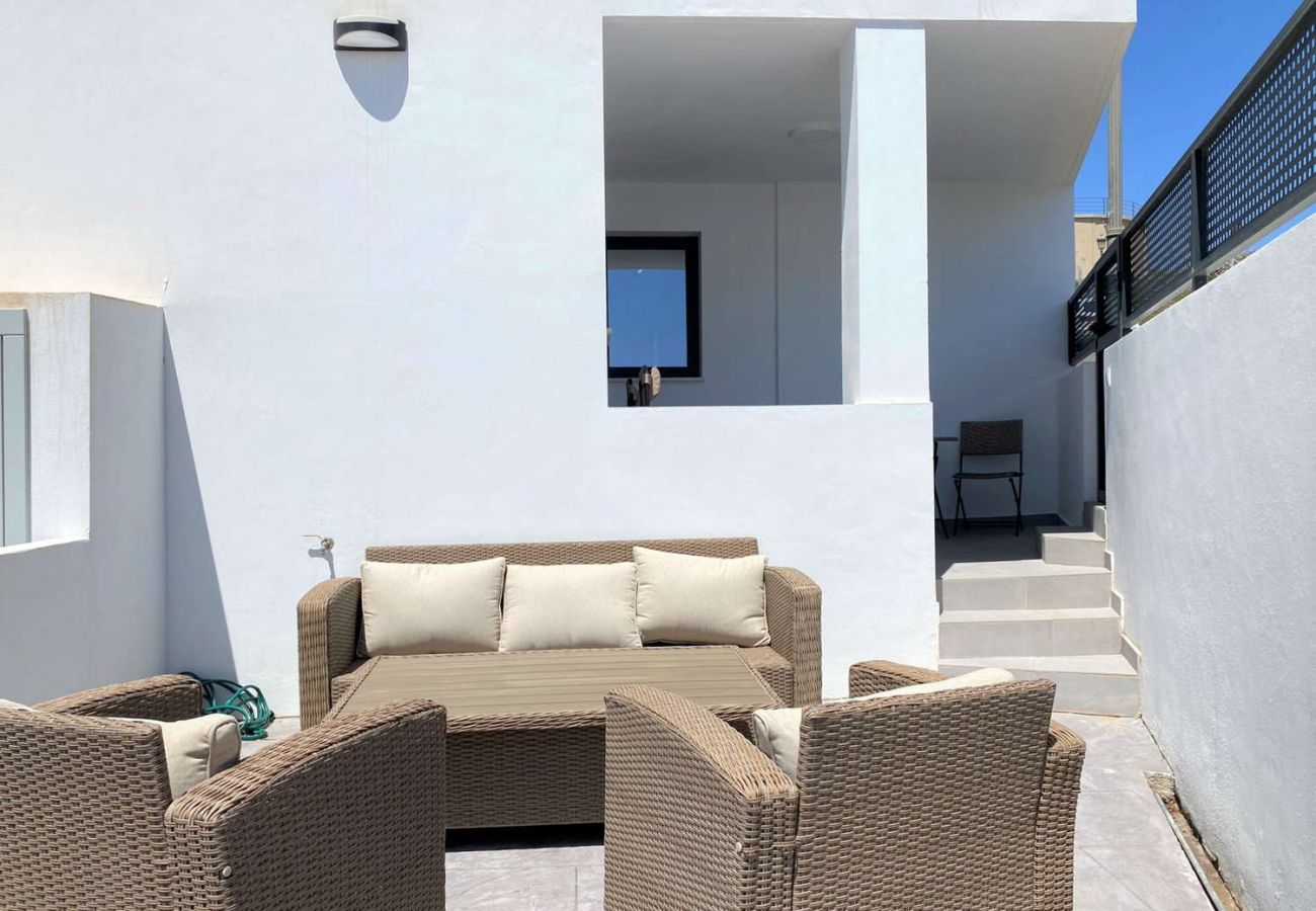 Apartment with two terraces in Nerja: second private terrace with sofas and lounge area.