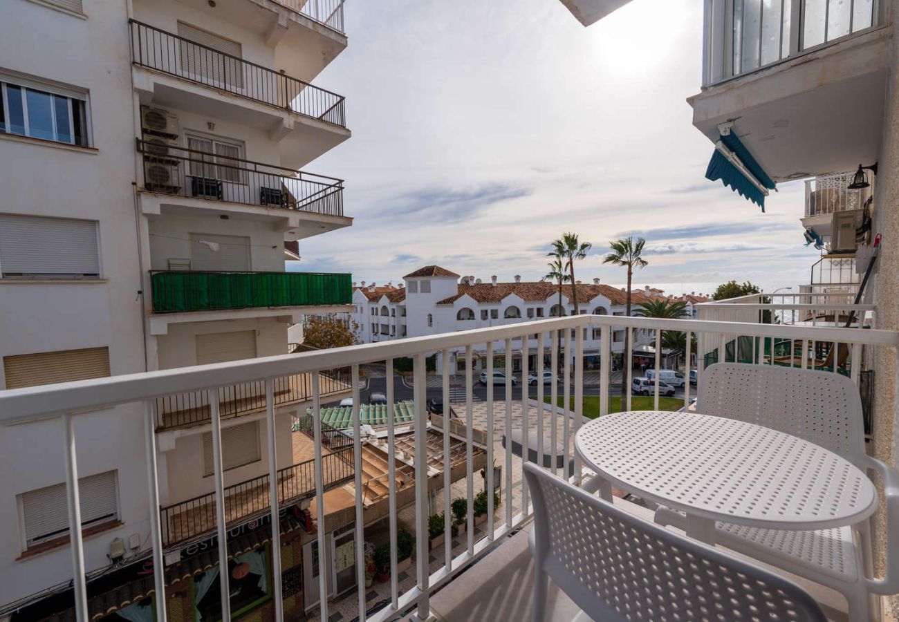 Private balcony with table and chairs for outdoor breakfast in Torrecilla Nerja.