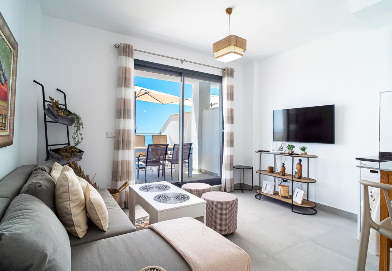 Modern and bright living room with private terrace access and panoramic Mediterranean Sea views in Nerja.