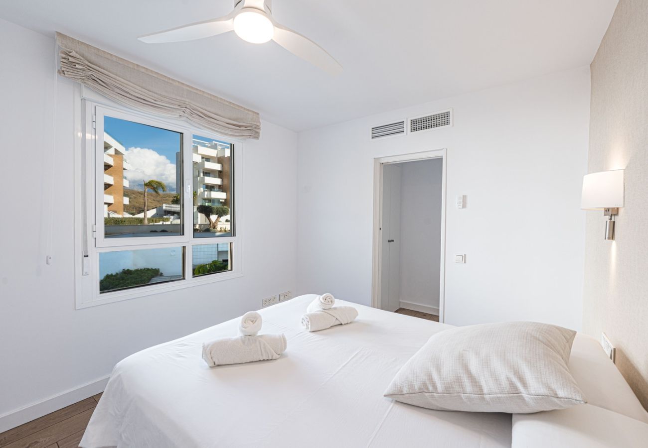 Modern master bedroom with double bed in a luxury apartment near El Peñoncillo Beach at Isea Calaceite