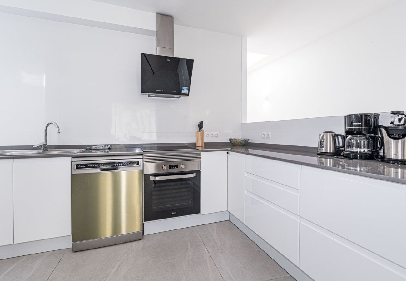 Fully equipped modern kitchen with high-end appliances in Nerja holiday apartment.