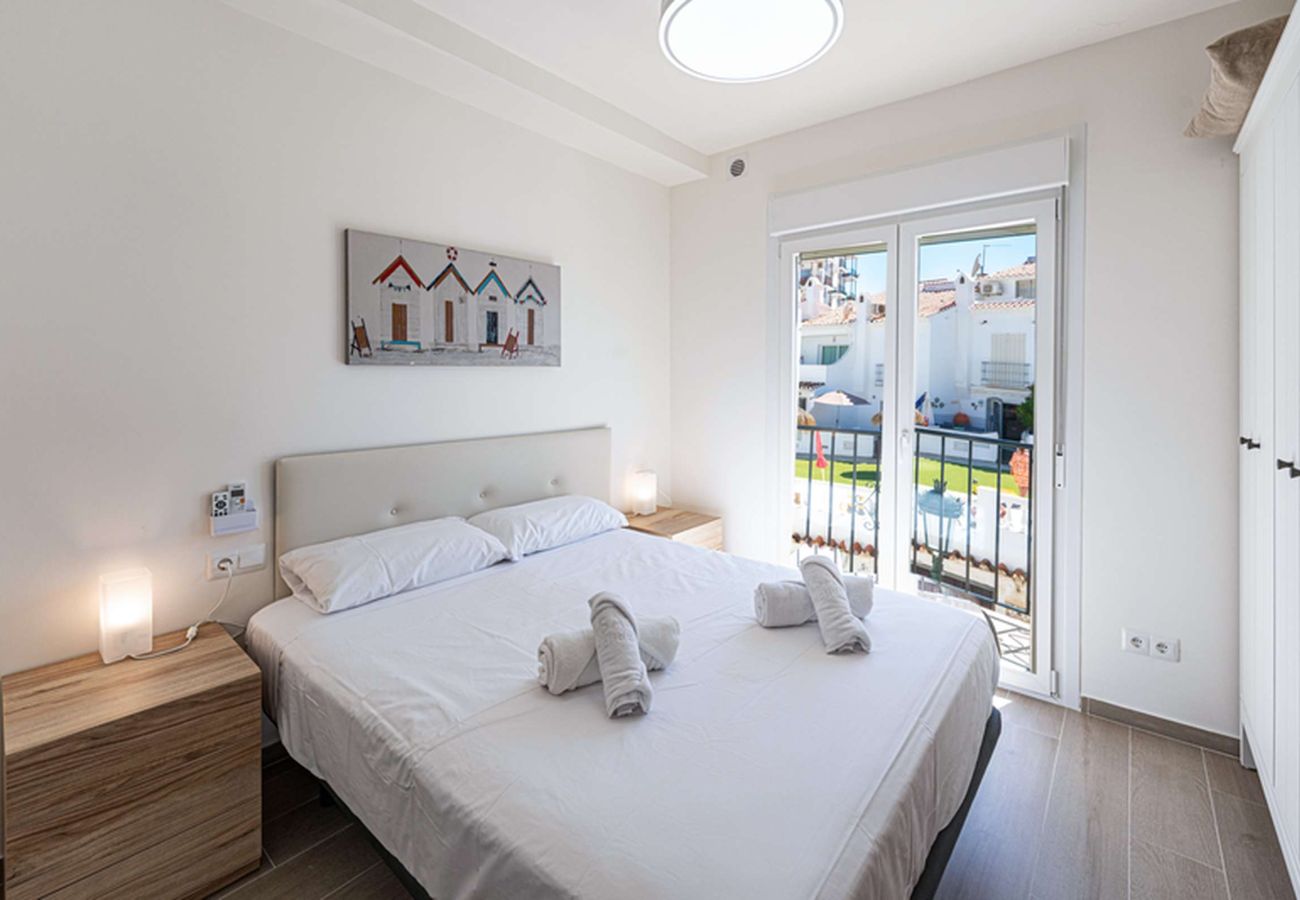 Cosy master bedroom with a double bed in the Nerja apartment.
